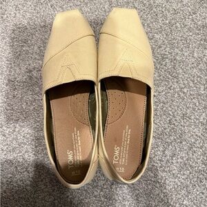 TOMS Women's Classic Canvas Slip-On Flats in Pale Yellow